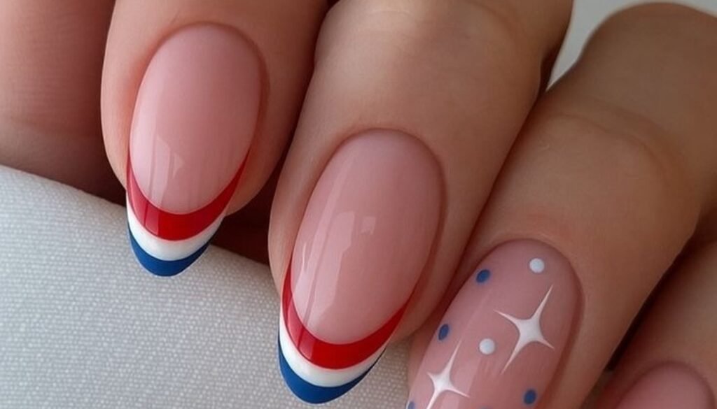 oval manicured nails with red white and blue french tips and star accent art