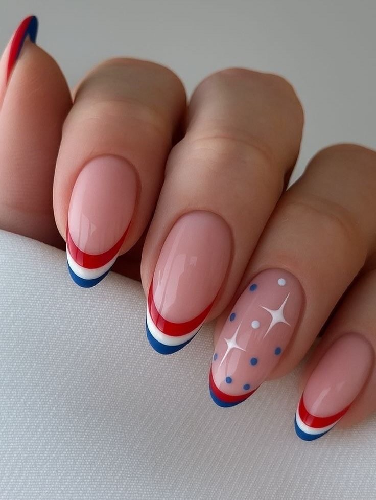 oval manicured nails with red white and blue french tips and star accent art