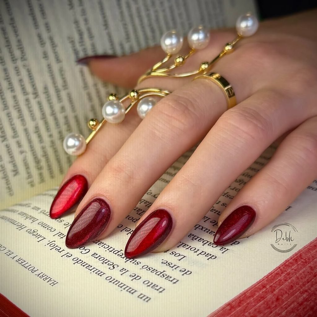 deep ruby red magnetic cat eye gel polish on long oval nails