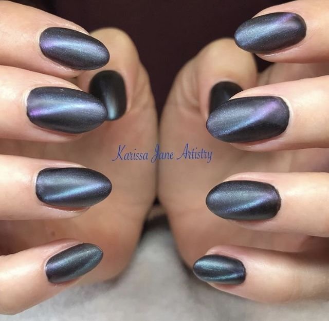 dark gray matte cat eye manicure on short oval nails
