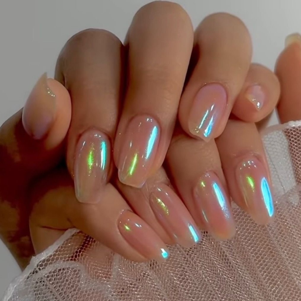 short square nails with an iridescent shifting blue and green chrome finish