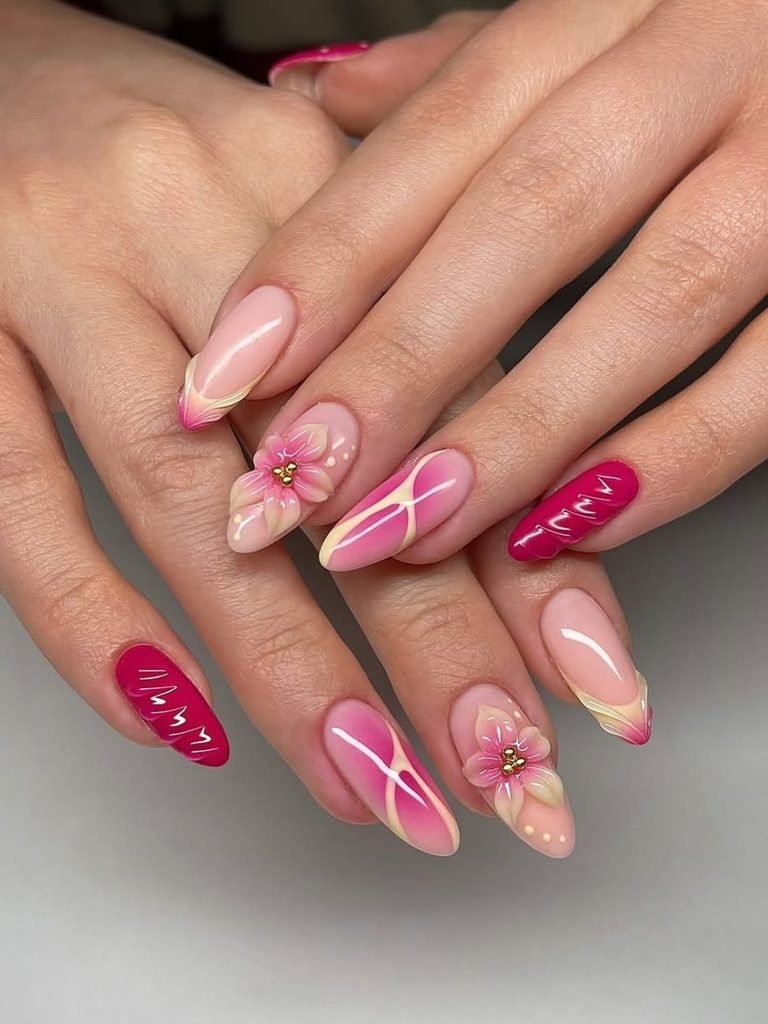 vibrant pink almond gel nails featuring 3d floral accents and abstract swirl designs