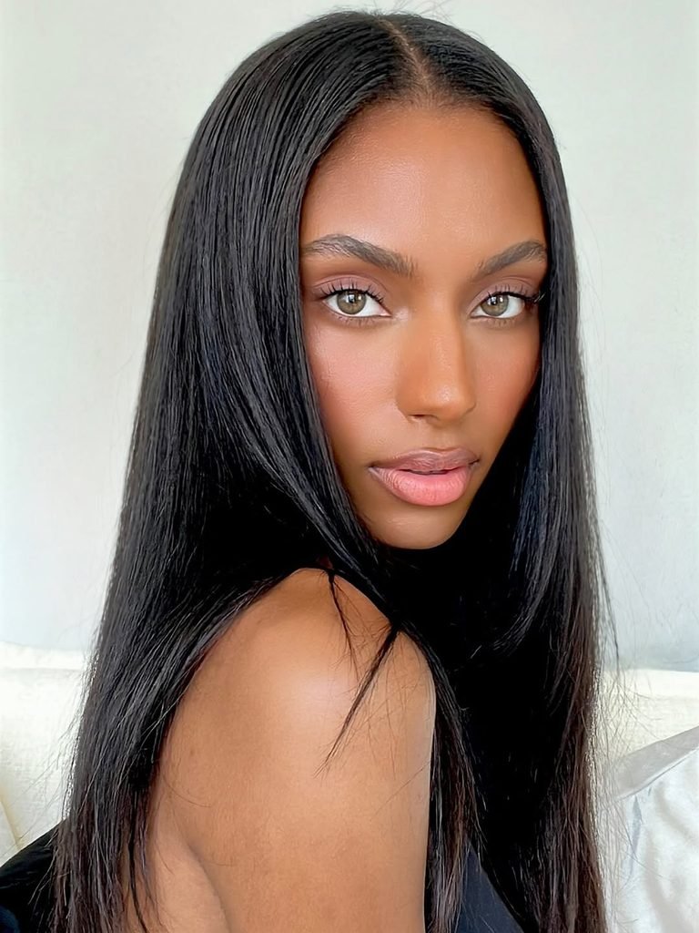 woman with long, sleek bone-straight black hair with a middle part