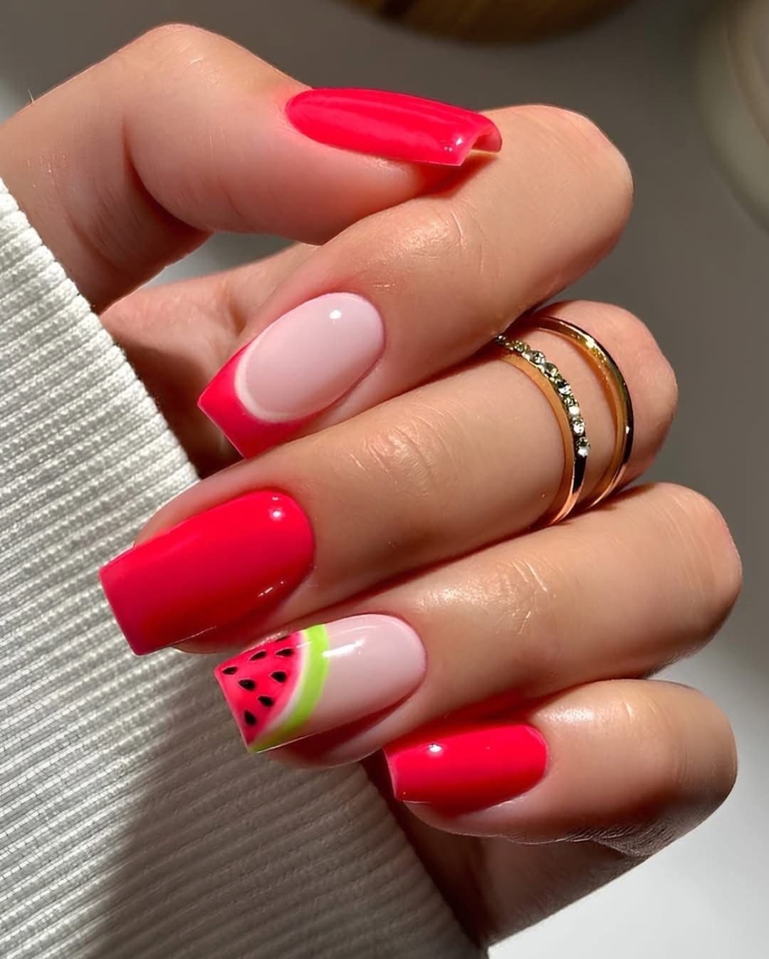 hot pink french tip manicure featuring a detailed watermelon slice accent nail