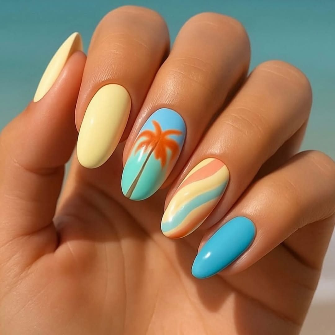 summer manicure with yellow, blue, and orange palm tree nail art