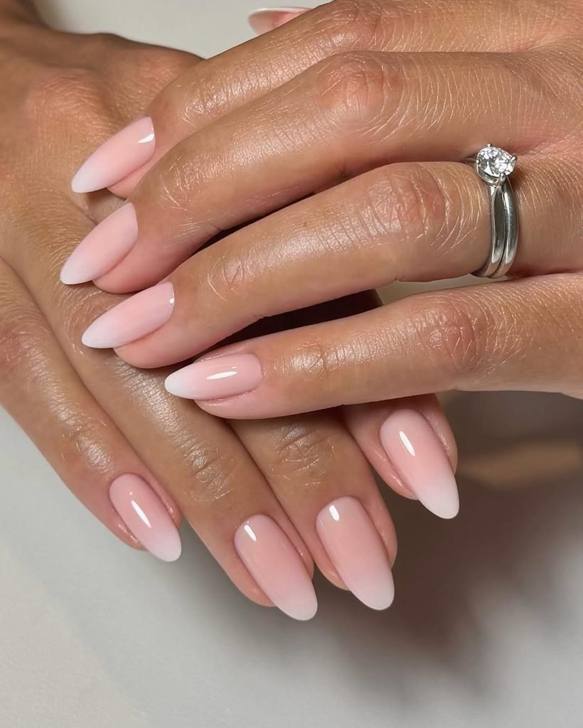 classic nude and white ombre french fade manicure on almond shaped nails