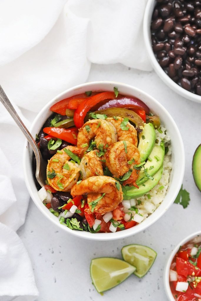 shrimp fajita bowl with avocado, peppers, black beans, and white rice