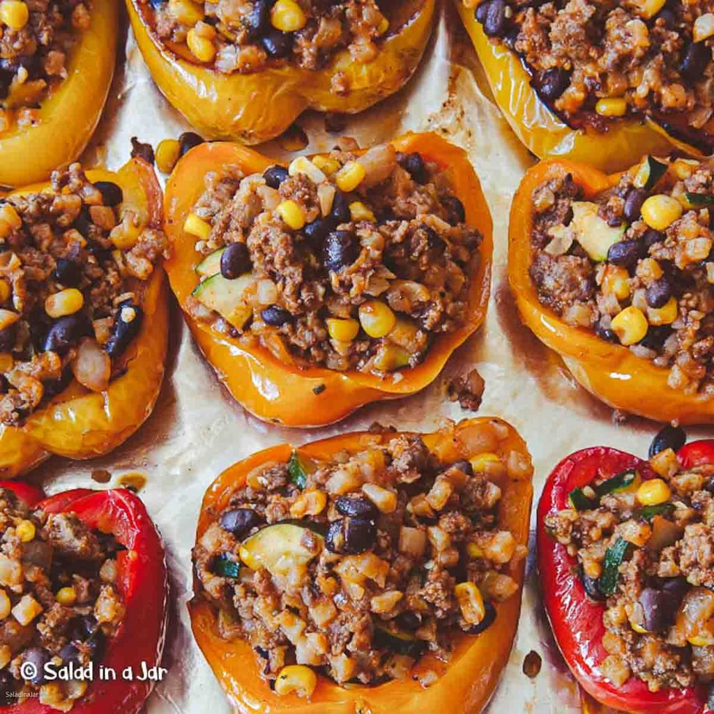 bell peppers stuffed with seasoned ground beef, black beans, and corn