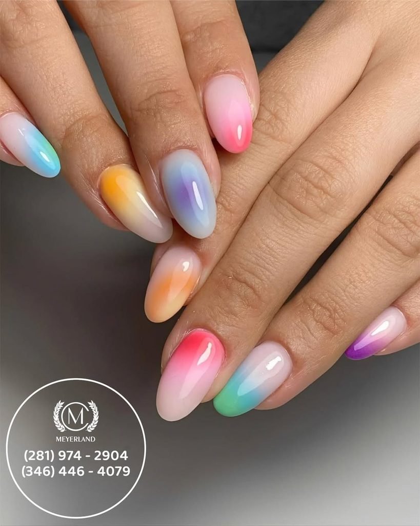 pastel aura gradient nail art on long almond nails with a glossy finish