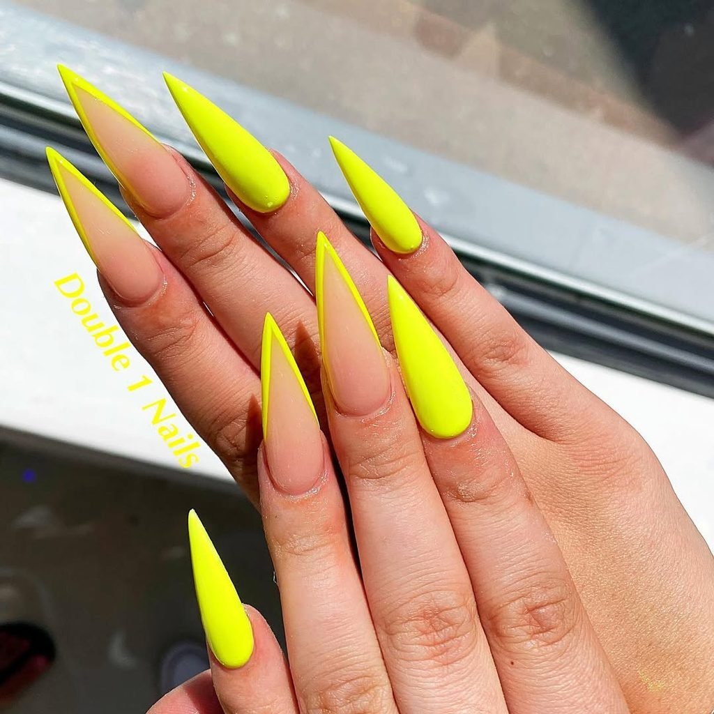 extra long neon yellow stiletto nails with standard and outlined french tips