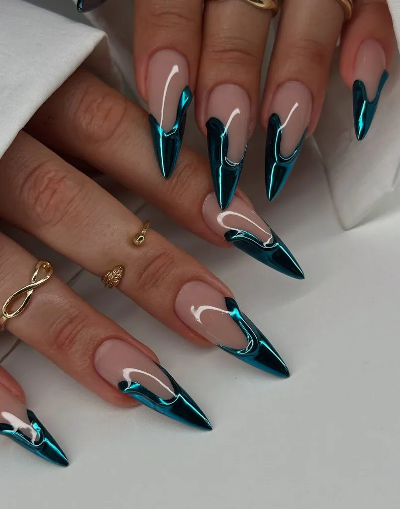 long pointed stiletto nails with metallic teal chrome abstract tips